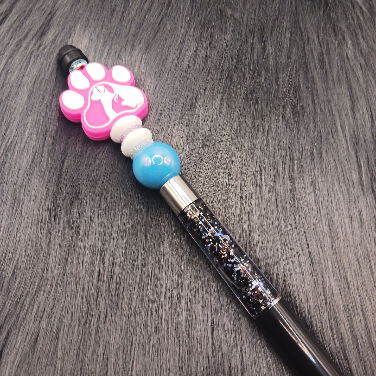 Pink animal pawprint snowglobe pen