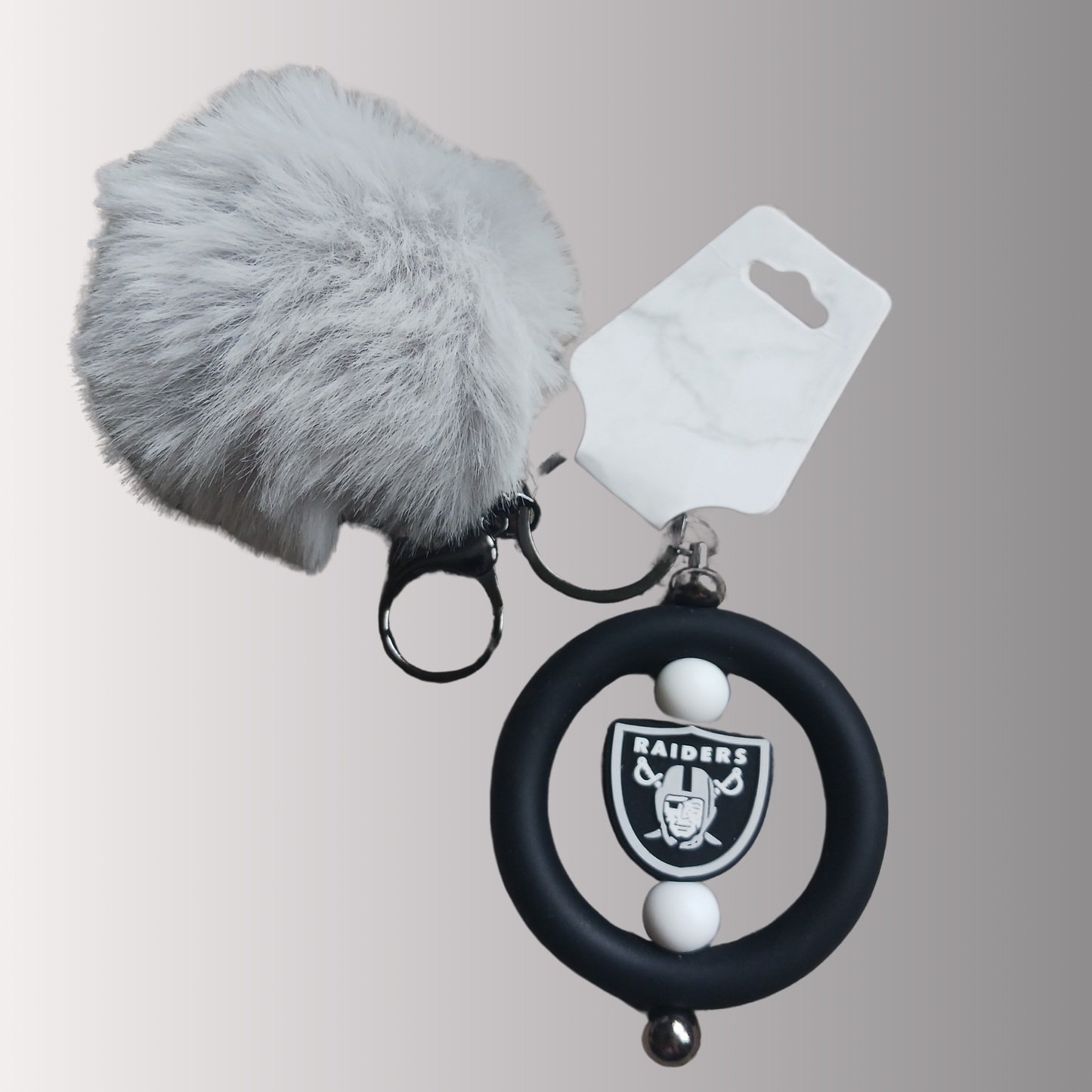 Team Raid keychain with pom-pom