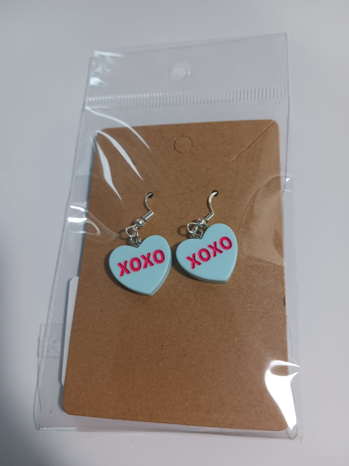 XOXO heart dangle earrings