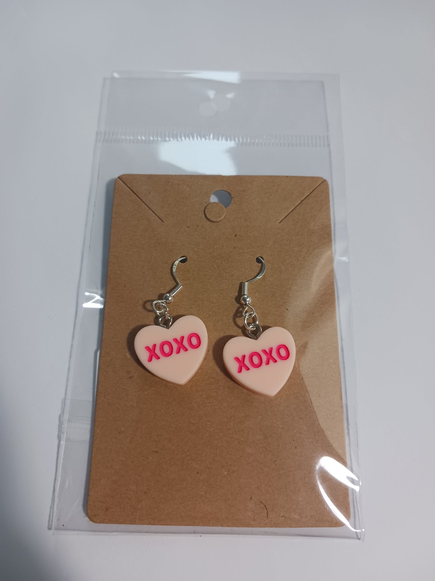 XOXO heart dangle earrings