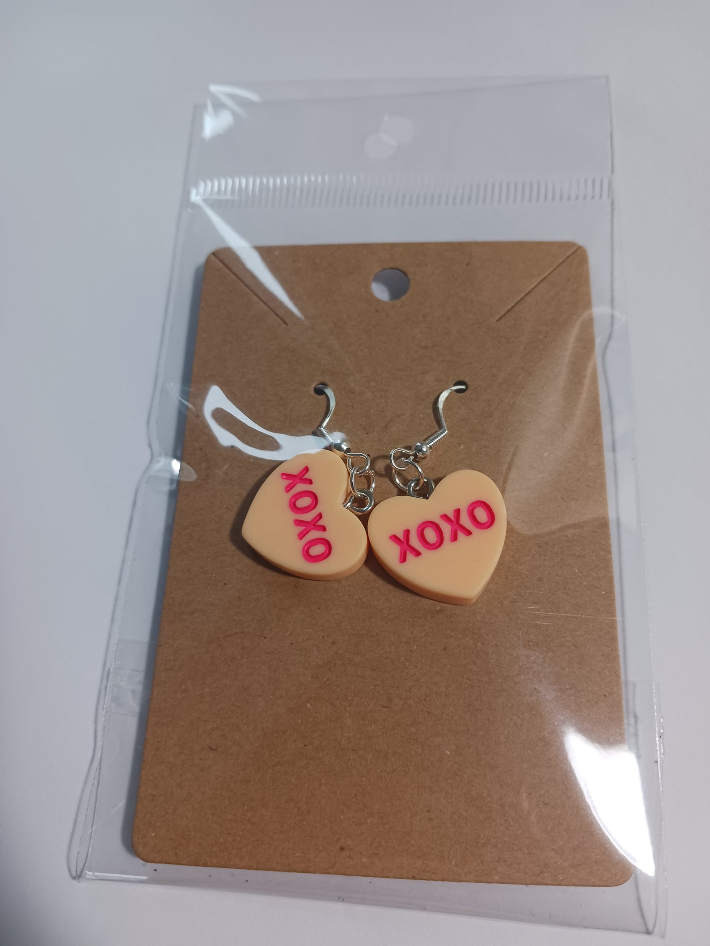 XOXO heart dangle earrings