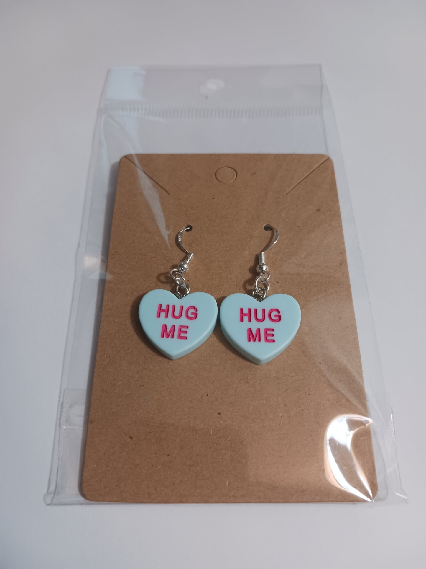 Hug me message heart earrings