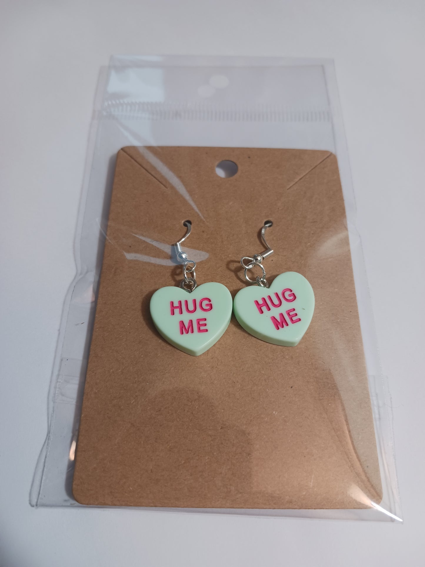 Hug me message heart earrings