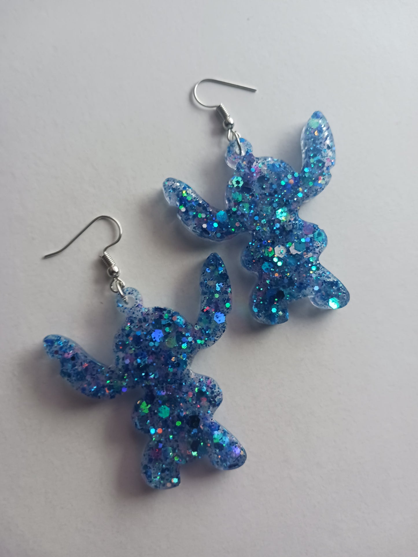 Large fun blue alien shaped earrings