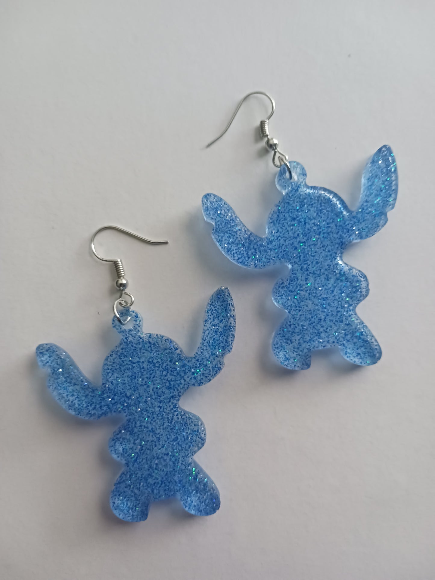 Large fun blue alien shaped earrings