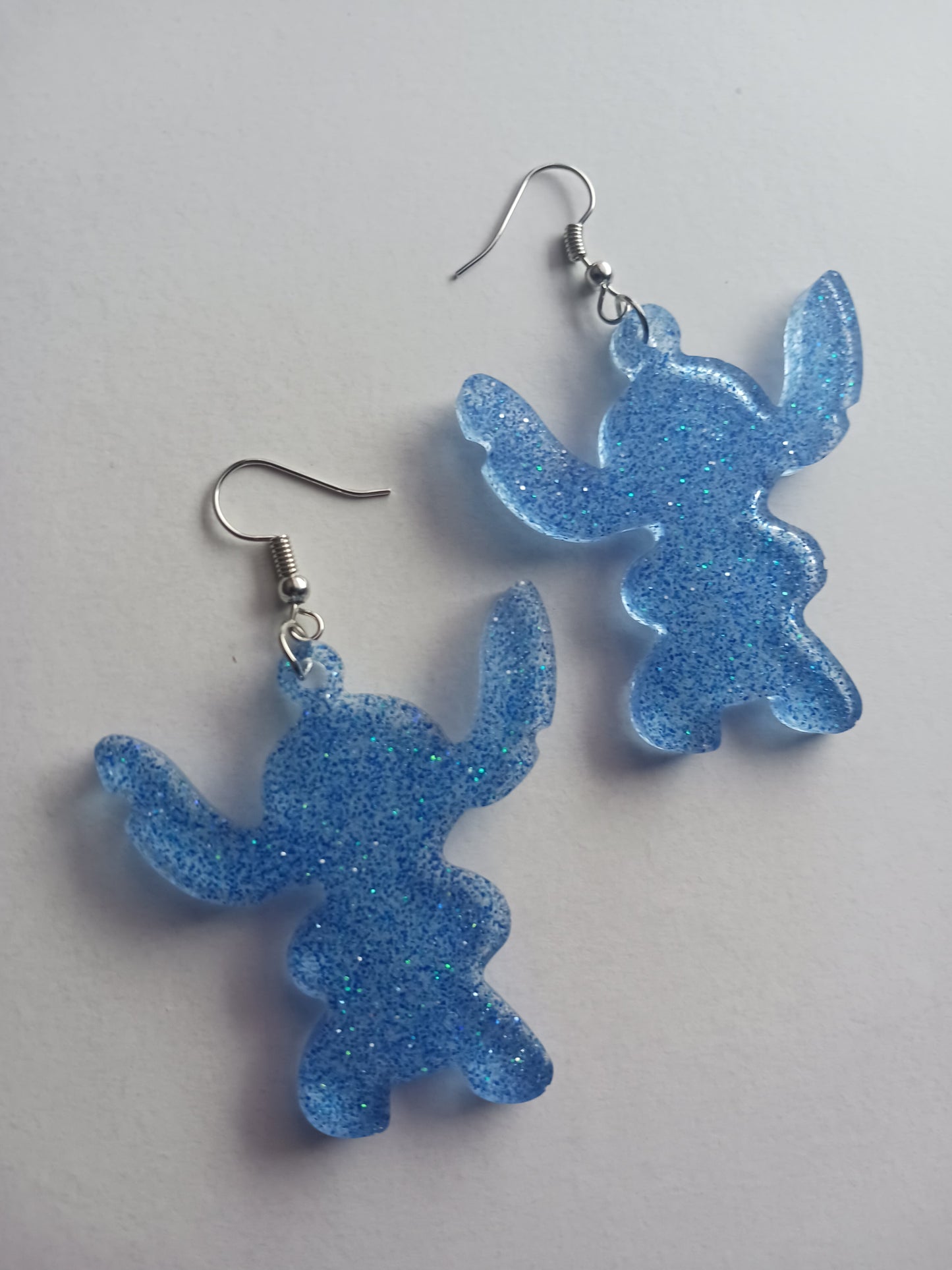 Large fun blue alien shaped earrings