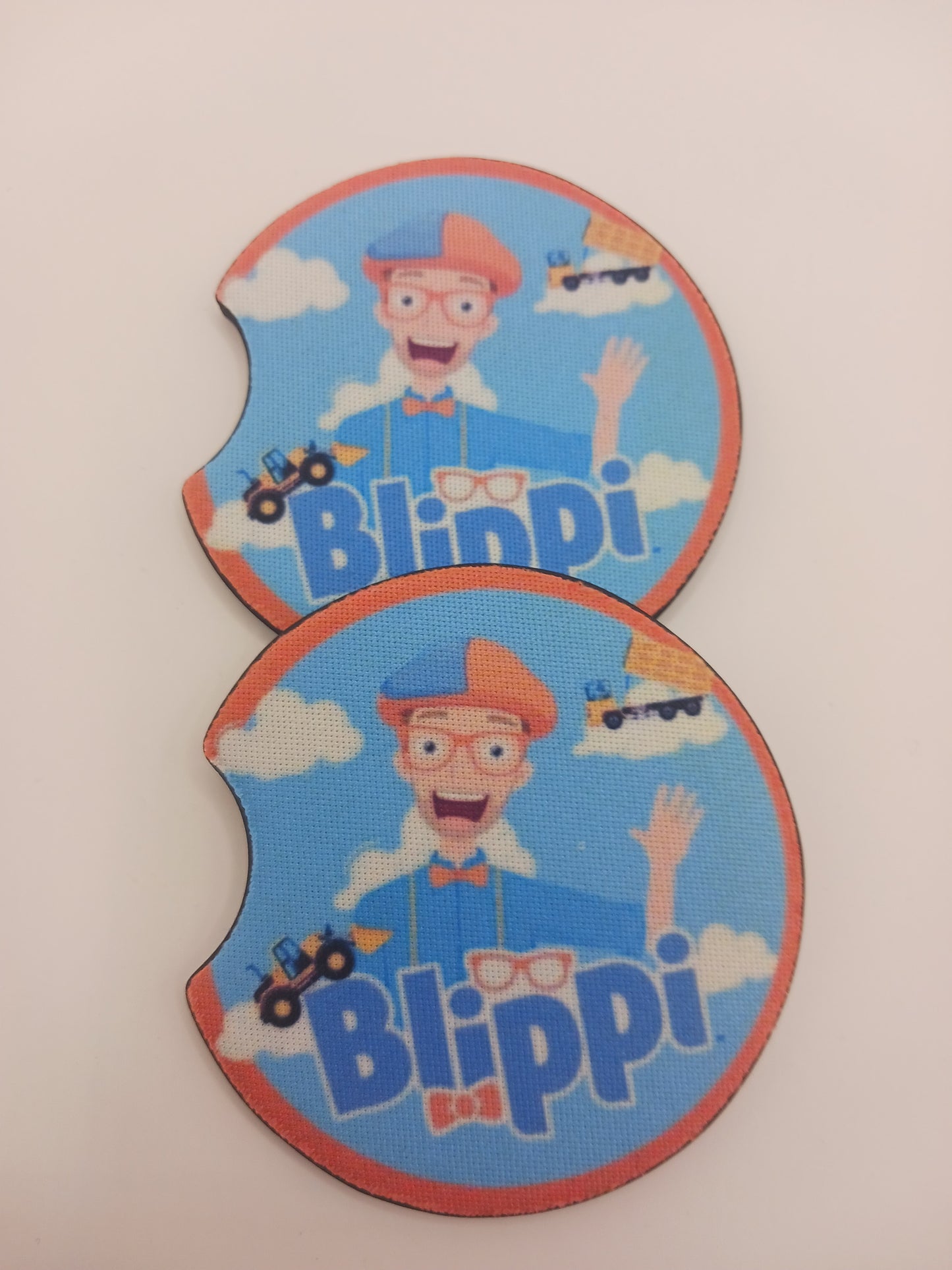 Orange and blue character car coasters