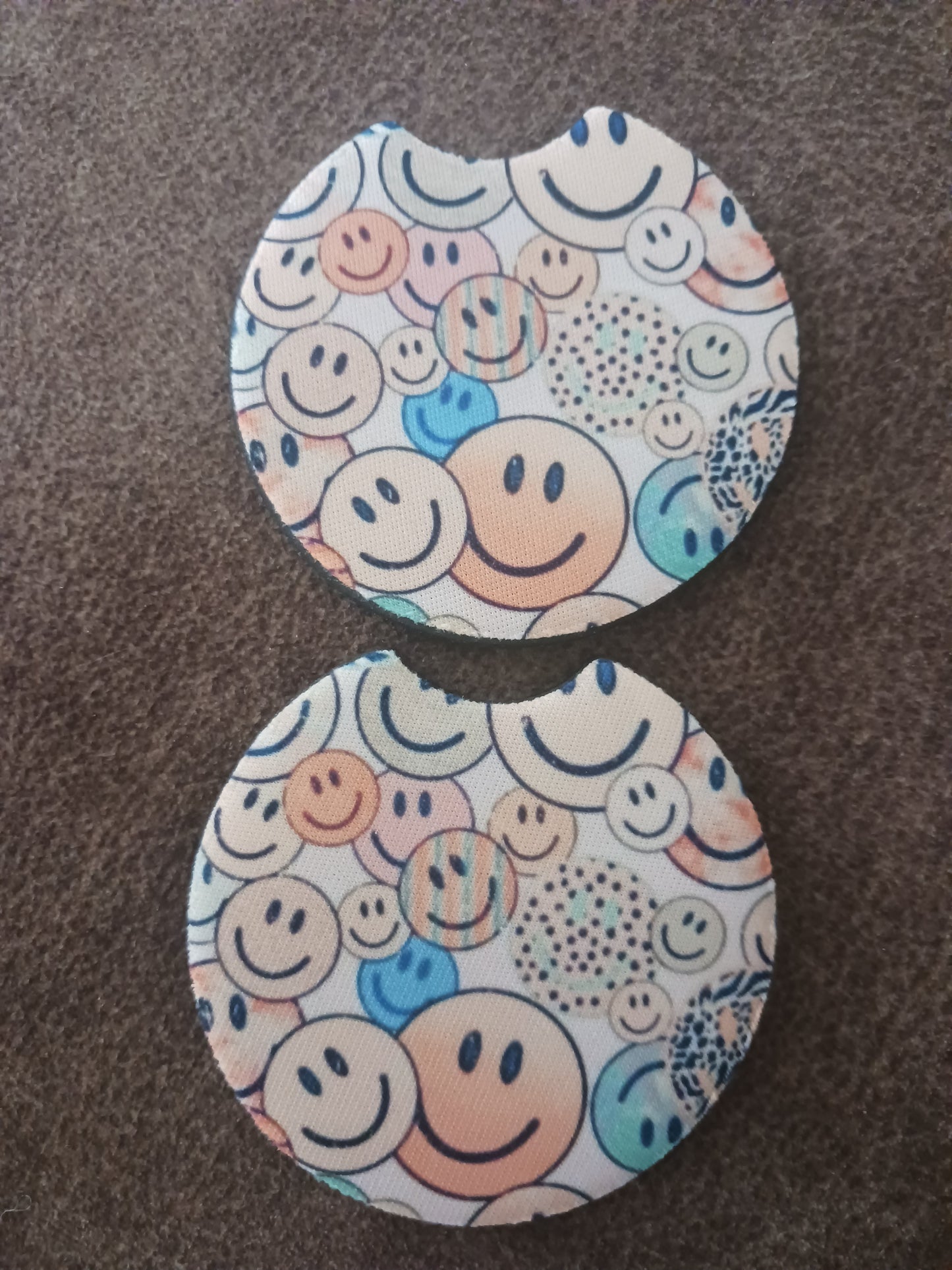 Tan smiley face car coasters