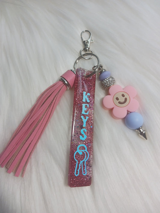 Pink flower keychain bar with tassel