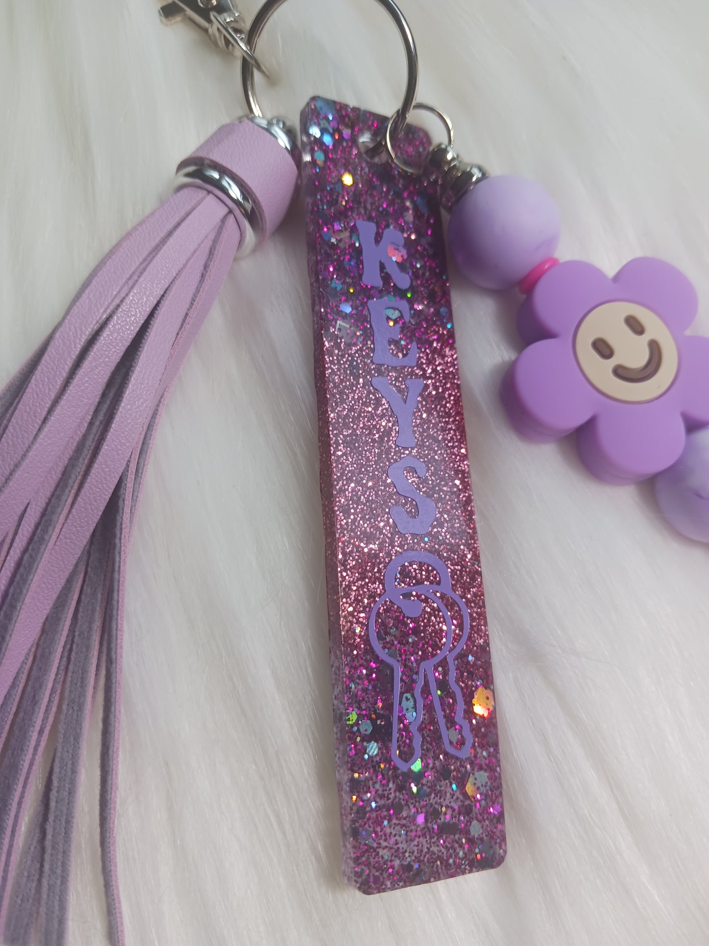 Purple flower keychain bar with tassel