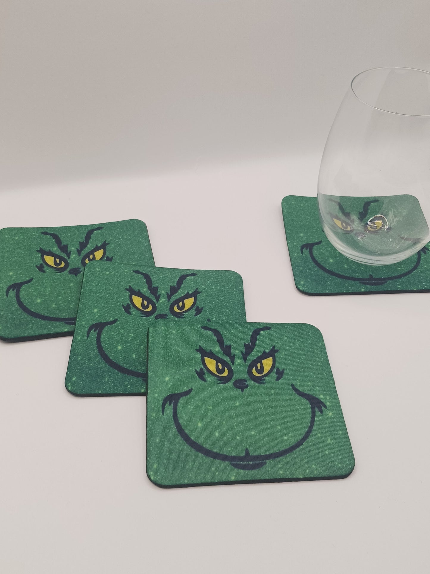 The Christmas green guy tabletop coasters