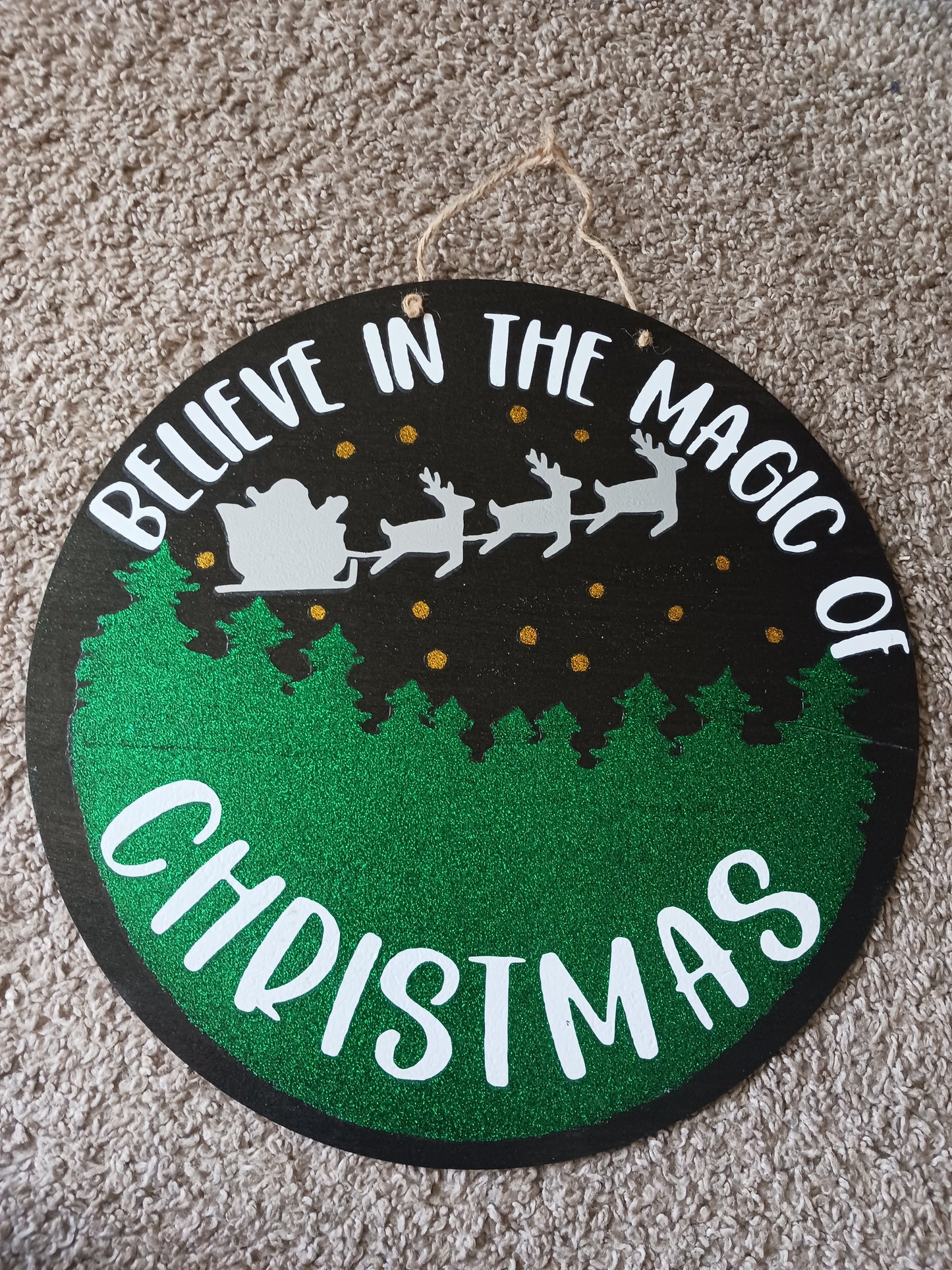 The magic of Christmas door hanger