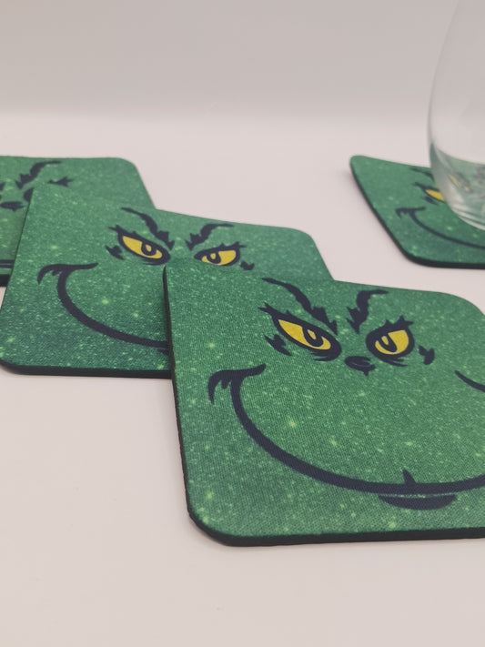 The Christmas green guy tabletop coasters