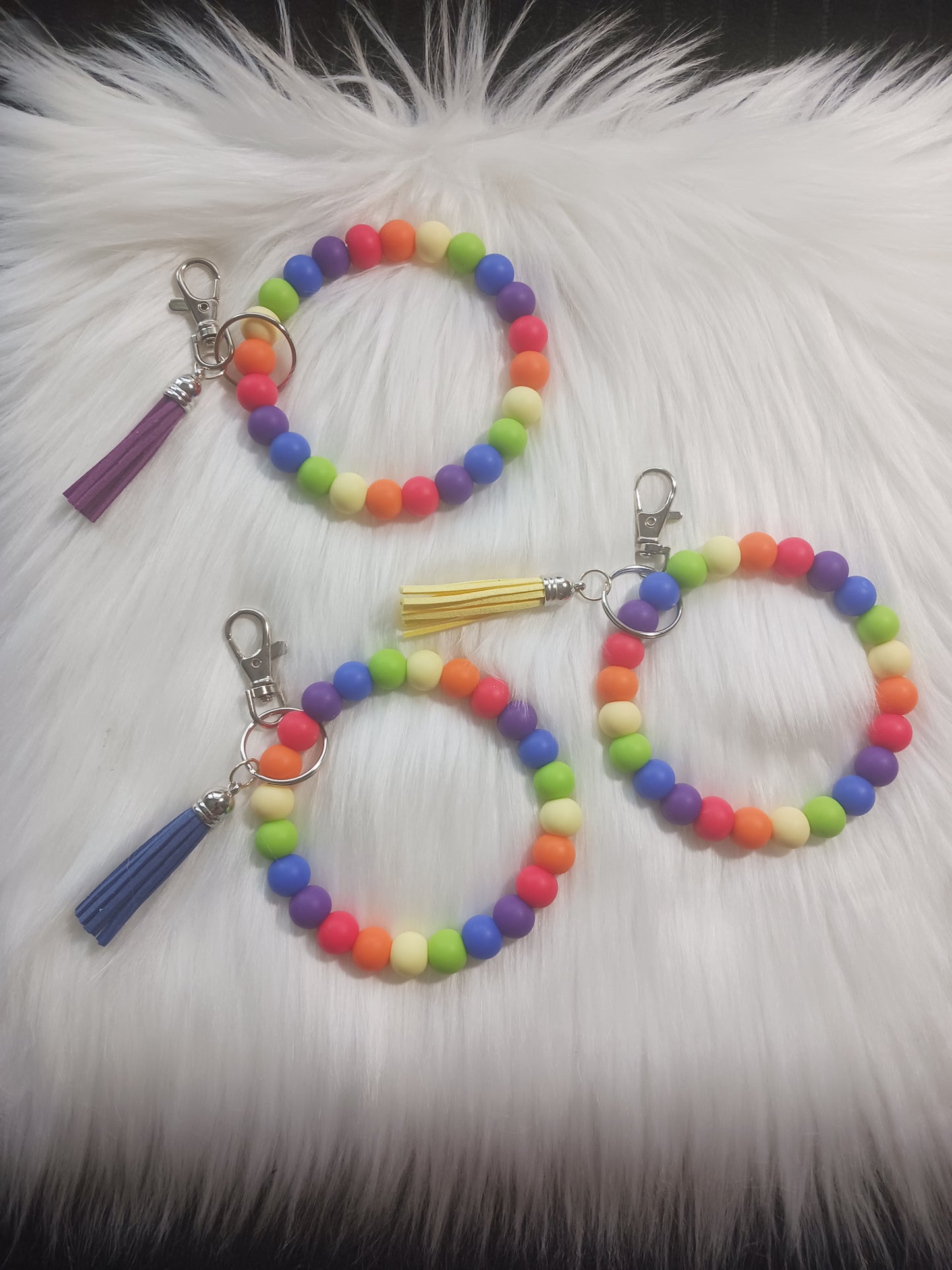 Rainbow colored silicone beaded wristlet with tassel