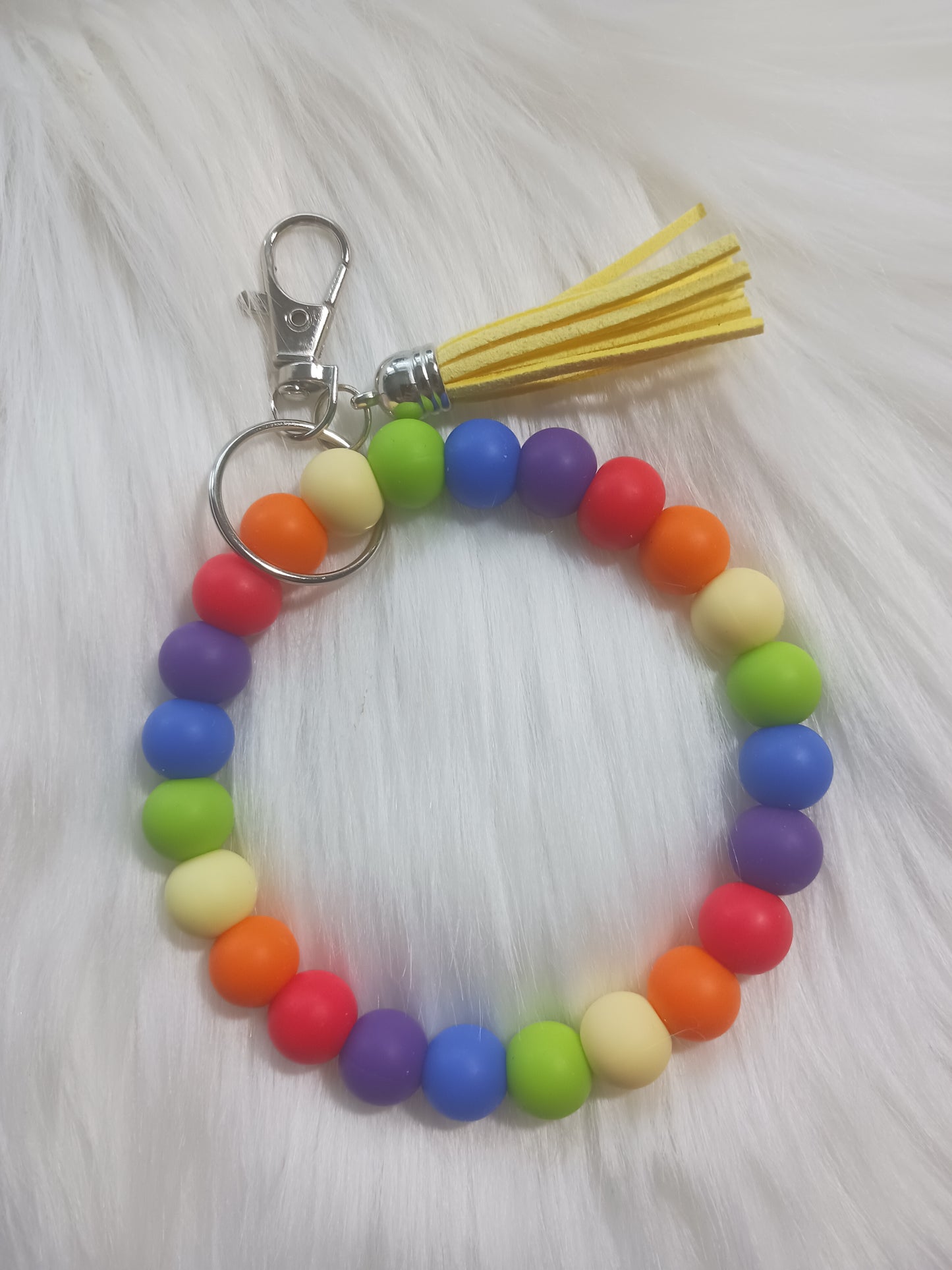 Rainbow colored silicone beaded wristlet with tassel