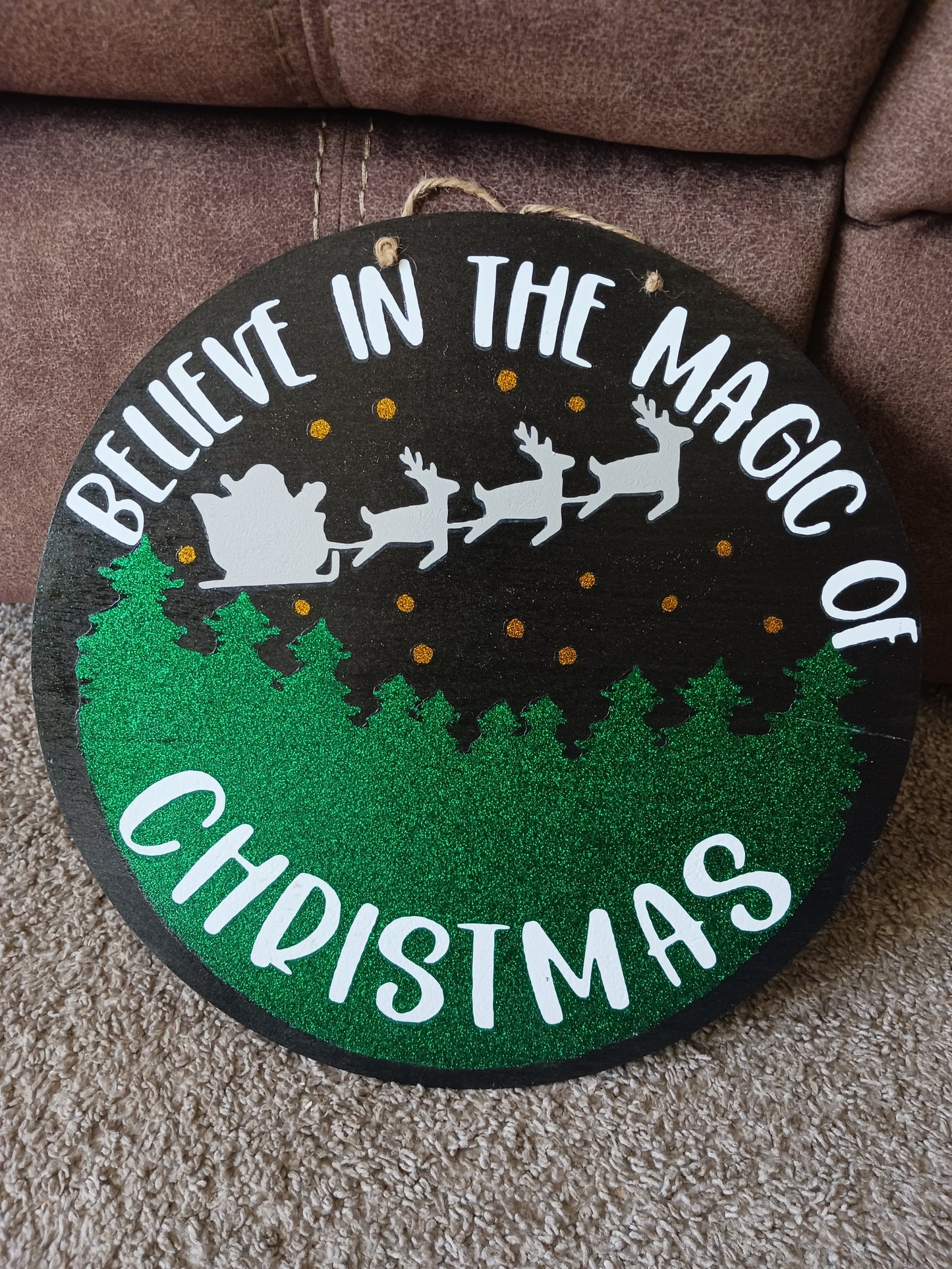 The magic of Christmas door hanger