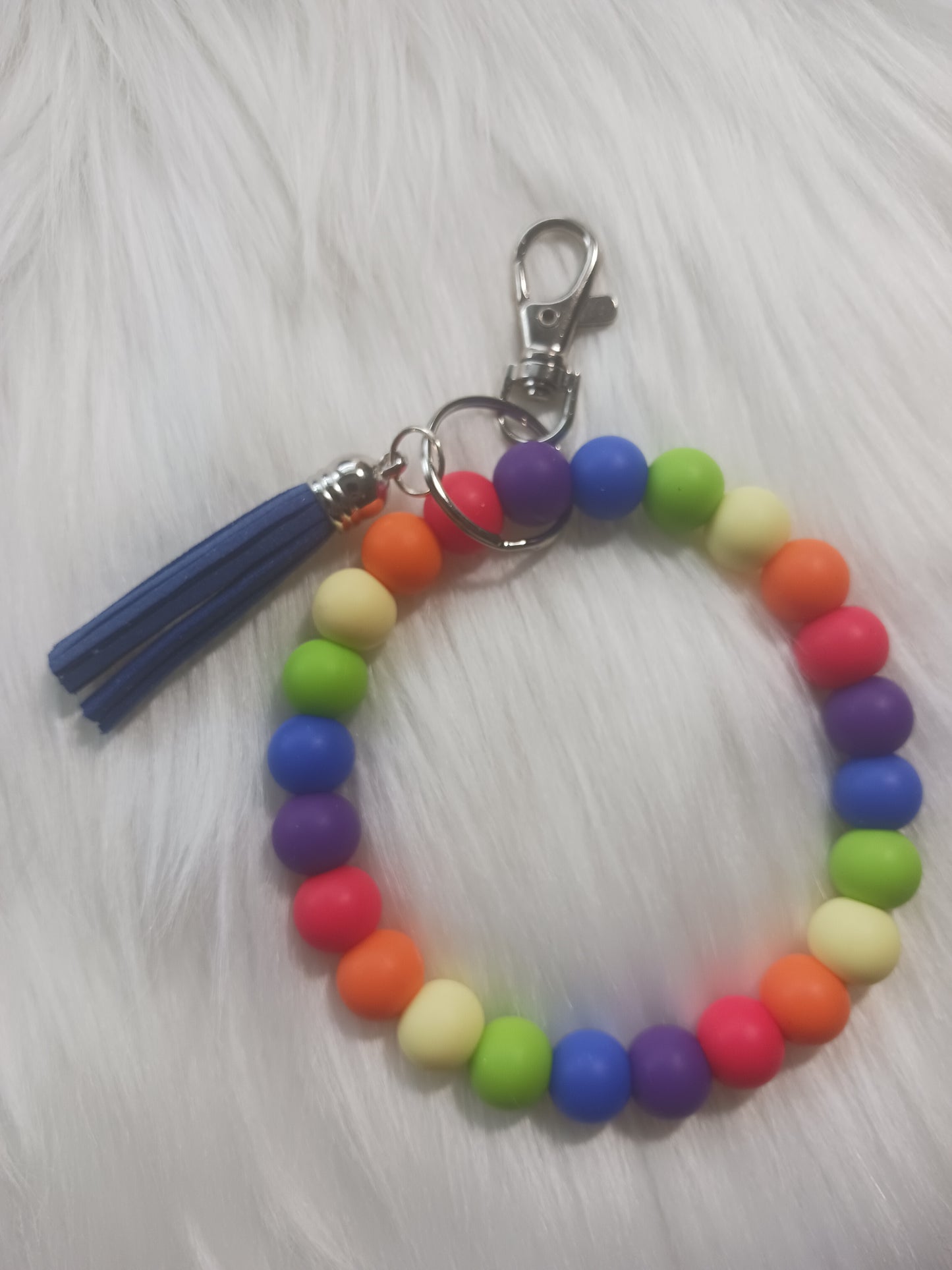 Rainbow colored silicone beaded wristlet with tassel