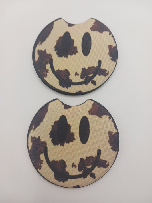 Cow print smiley car coasters